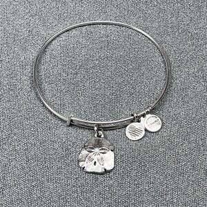 Alex and Ani bangle bracelet with sand dollar charm.